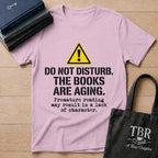 Do Not Disturb The Books Are Aging T-Shirt