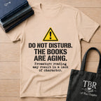 Do Not Disturb The Books Are Aging T-Shirt