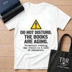 Do Not Disturb The Books Are Aging T-Shirt